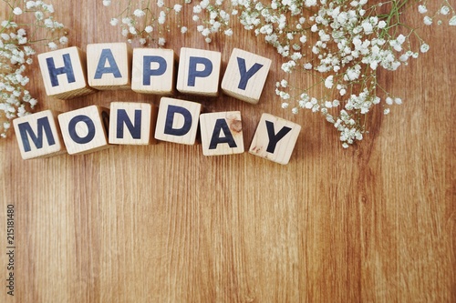 happy monday alphabet letters on wooden background