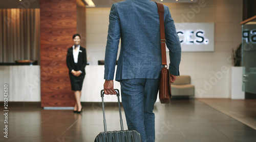 Business traveler arriving at hotel © Jacob Lund 