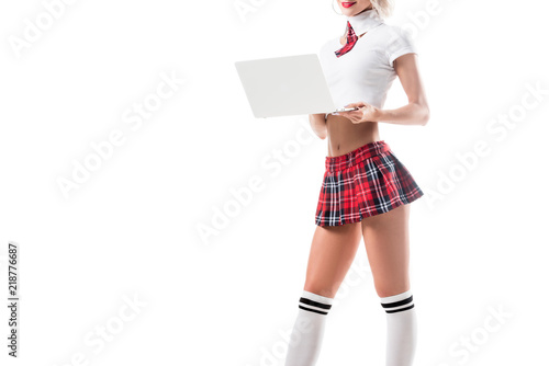 Cropped Shot Of Woman In Seductive Schoolgirl Uniform Using Laptop Isolated On White Cropped Shot Of Woman In Seductive Schoolgirl Uniform Using Laptop Isolated On White