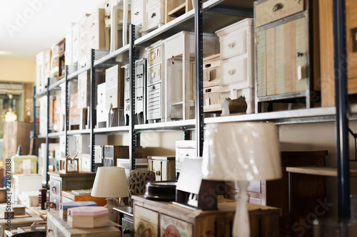 Old furniture offered for sale in secondhand shop
