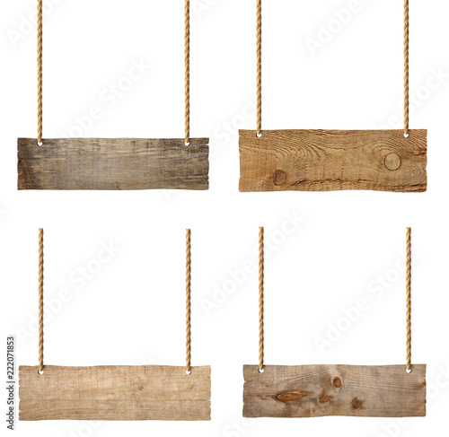 close up of an empty wooden sign hanging on a rope on white background