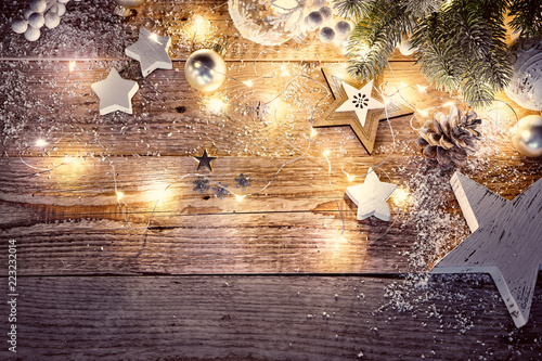 Christmas decoration in vintage style at old wooden board © Yasonya