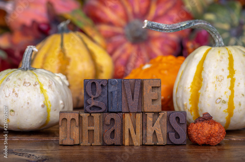 Give Thanks Text on a Colorful Background ao Autumn Squash © chas53