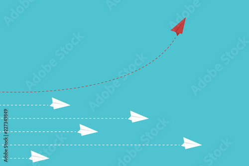 Think different. Think differently concept. Red airplane changing direction. New idea, change, trend, courage, creative solution, innovation and unique way concept.