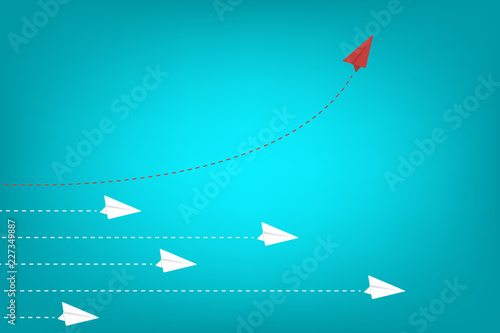 Think different. Think differently concept. Red airplane changing direction. New idea, change, trend, courage, creative solution, innovation and unique way concept.