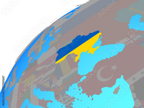 Ukraine with embedded national flag on globe. © harvepino
