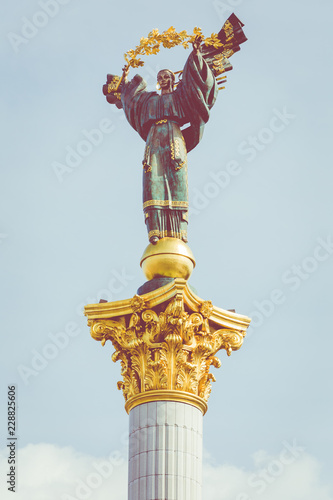 Statue of Independence and Liberty on marble pedestal in center of Kiev. © Curioso Photography