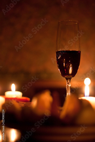 Romantic evening with red wine & candles. © dreamer19
