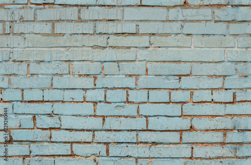 Tiled old painted blue brick wall background in Kyiv, Ukraine © Aleksander