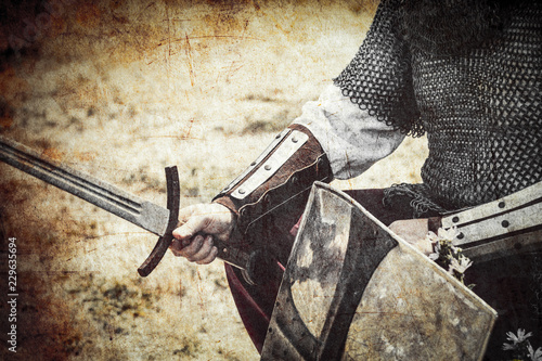 photo of the brave warrior holding his sword and shield