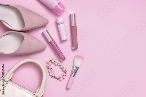 Layflat image of pink womans fashion and cosmetics products. © twenty2photo