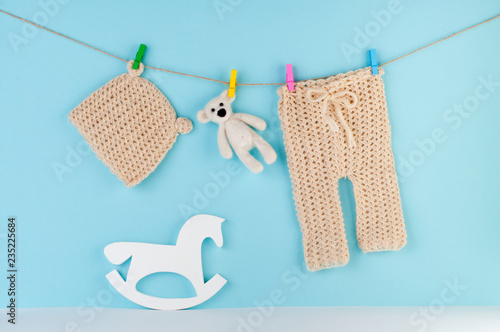 Newborn baby hat and pants on clothespins © lithiumphoto