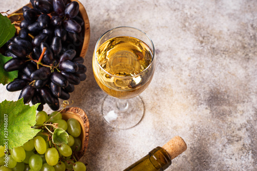 Grape, bottle and glass of white wine 