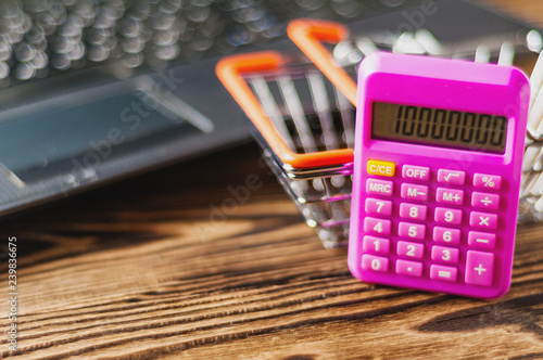 Market Basket And Calculator Old Dirty Laptop On Brown Table Market Basket And Calculator Old Dirty Laptop On Brown Table Online Trade Concept