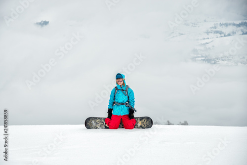 Young woman on the snowboard © nickolya