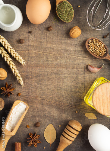 bakery ingredients on wooden background © Sergii Moscaliuk