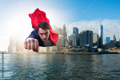 Superhero businessman flying over the city