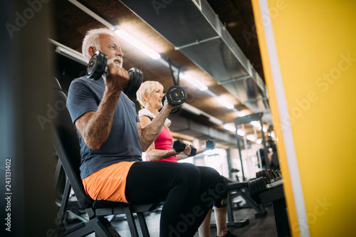 Happy fit mature man in gym working out to stay healthy © nd3000