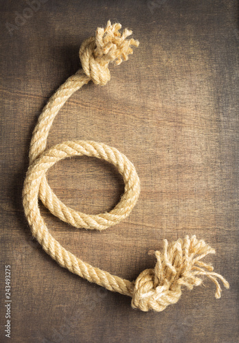 ship rope at wooden background © Sergii Moscaliuk
