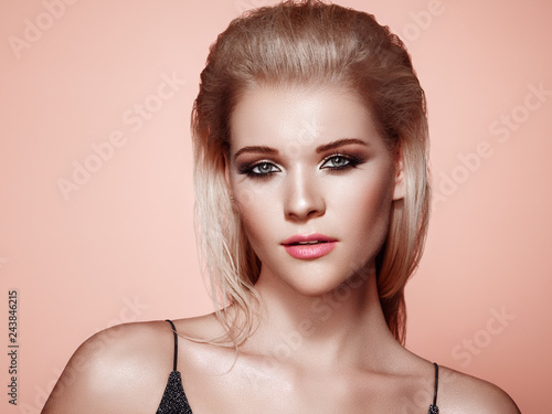 Blonde Girl with Long and Shiny Hair. Beautiful Model Woman with Smooth Hairstyle. Care and Beauty Hair products. Perfect Make-Up. Makeup Look for Parties © Oleg Gekman