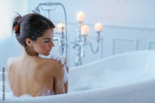 Woman in a bathtub © Yeko Photo Studio