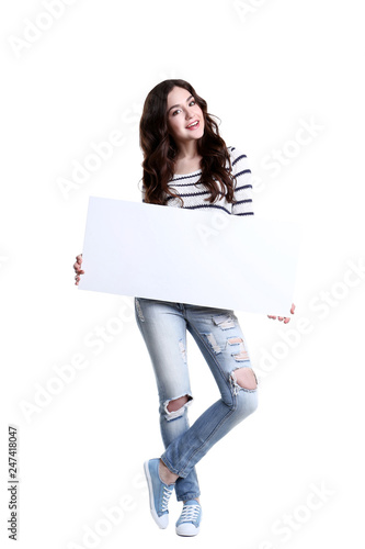 Beautiful young woman holding white blank board © 5second