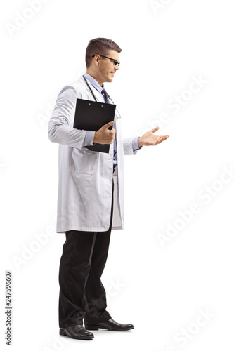 Young male doctor in a lab coat standing and gesturing a conversation © Ljupco Smokovski
