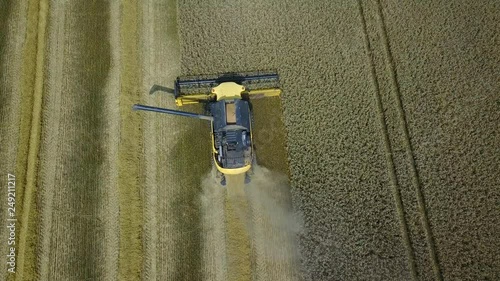 combine harvester working in field © blackboxguild