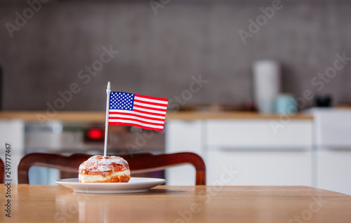 donut with USA flag on white plate © Masson
