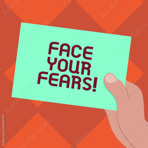 Handwriting text writing Face Your Fears. Concept meaning Have the courage to overcome anxiety be brave fearless Drawn Hu analysis Hand Holding Presenting Blank Color Paper Cardboard photo