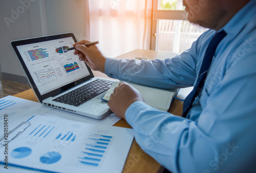 Business team working on a new business plan with modern digital computer