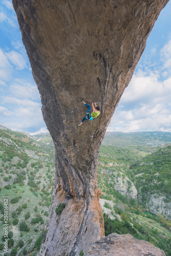 Male sport climber on steep overhanging wall