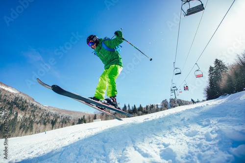 Skiing. Jumping skier. Extreme winter sports. © Mediteraneo