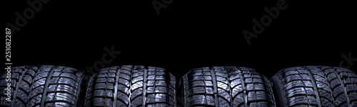 Car tires isolated panorama on black background © Alex Tihonov