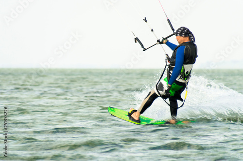Kitesurfing Kiteboarding action photos man among waves quickly goes © alexytrener