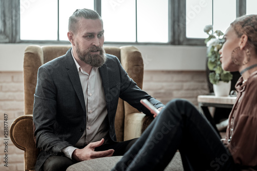 Psychologist giving piece of advice to emotional teenage girl
