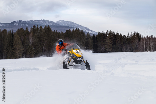 Athlete on a snowmobile. © 02irina