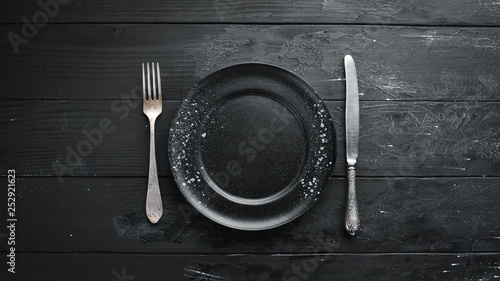 Old cutlery on a dark background. Top view. Free copy space. © Yaruniv-Studio