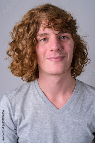 Face of young handsome man with curly hair © Ranta Images