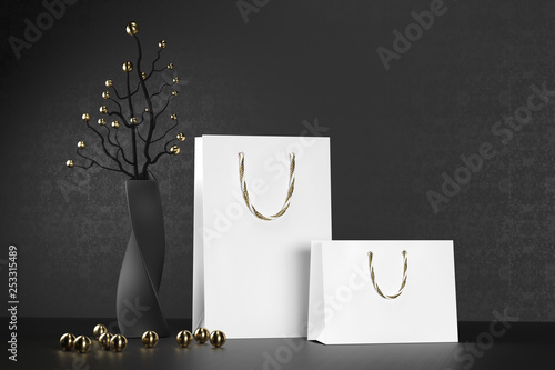 Luxury white paper shopping bag with handles Mock Up. Premium black package for purchases mockup on a black background. 3d rendering.