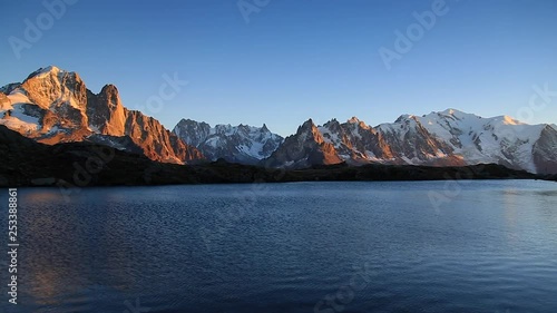 Panning shot of the Alps near Chamonix during a sunset at Lac des Cheserys. © sanderstock