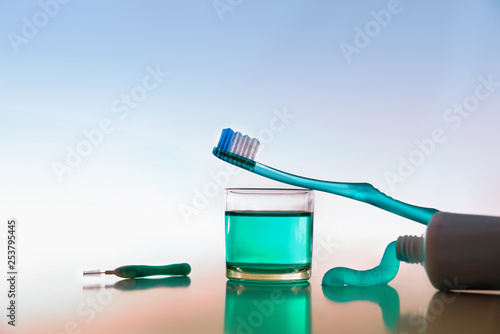 Tools and products for oral hygiene on white table colored © Davizro Photography