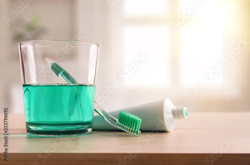 Concept oral hygiene on wood table in bathroom at home © Davizro Photography