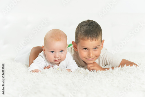 Close up portrait of beautiful boys on a bed © aletia2011