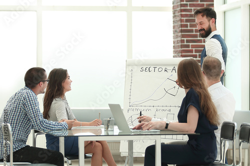business team holds a meeting in a modern office © yurolaitsalbert
