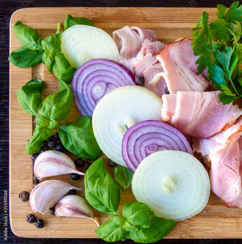 Wododen board with bacon, basil, onion and garlic © whiteflower
