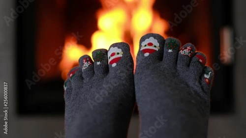 Hygge concept with funny girls socks with christmas prints © ivan kmit