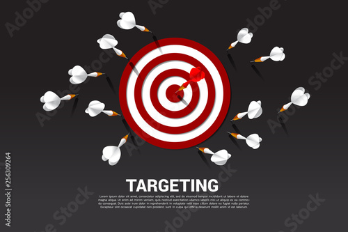 one of dart arrow hit the center of dartboard . Business Concept of missing the marketing target and customer. Success on company mission and goal. © Panithan
