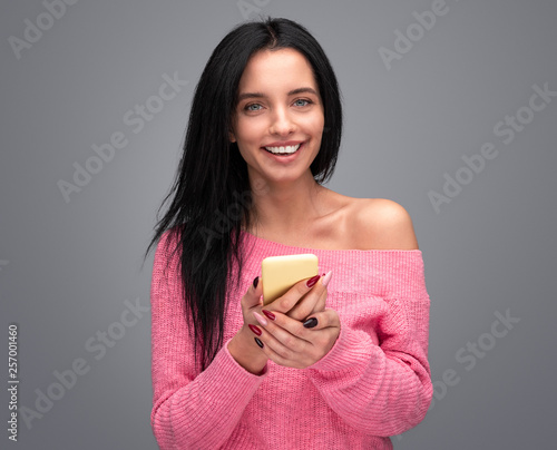 Elegant woman with smartphone smiling © kegfire
