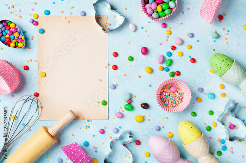 Easter baking background with kitchen tools for holiday sweet bakery top view. Flat lay. © juliasudnitskaya
